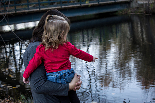 picture of mother and daughter by lake