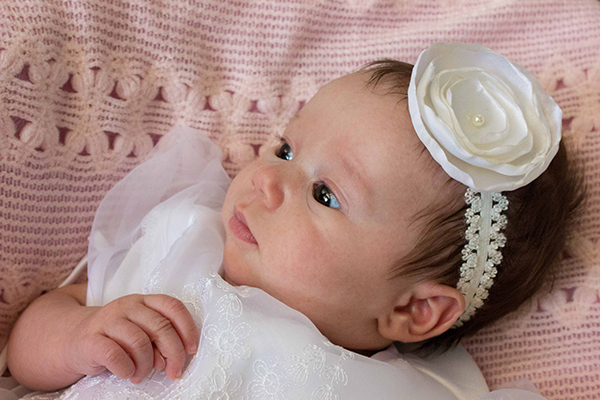 picture of baby on pink blanket