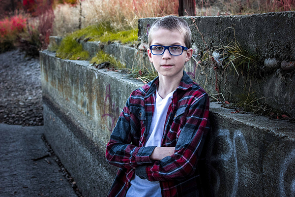 picture of boy by wall